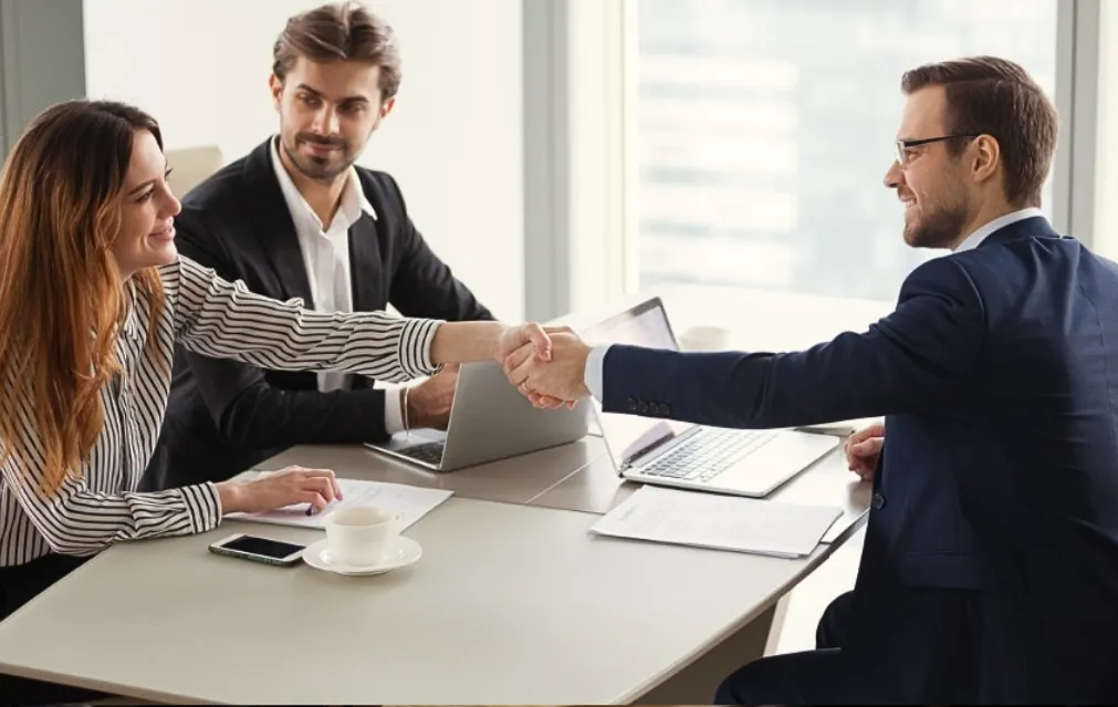 Corporate lawyer reviewing a business contract with a client.